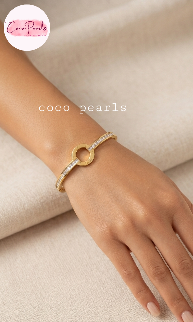 Coco pearls stainless Steel anti tarnish gold diamond studded handcuff displayed on hand 