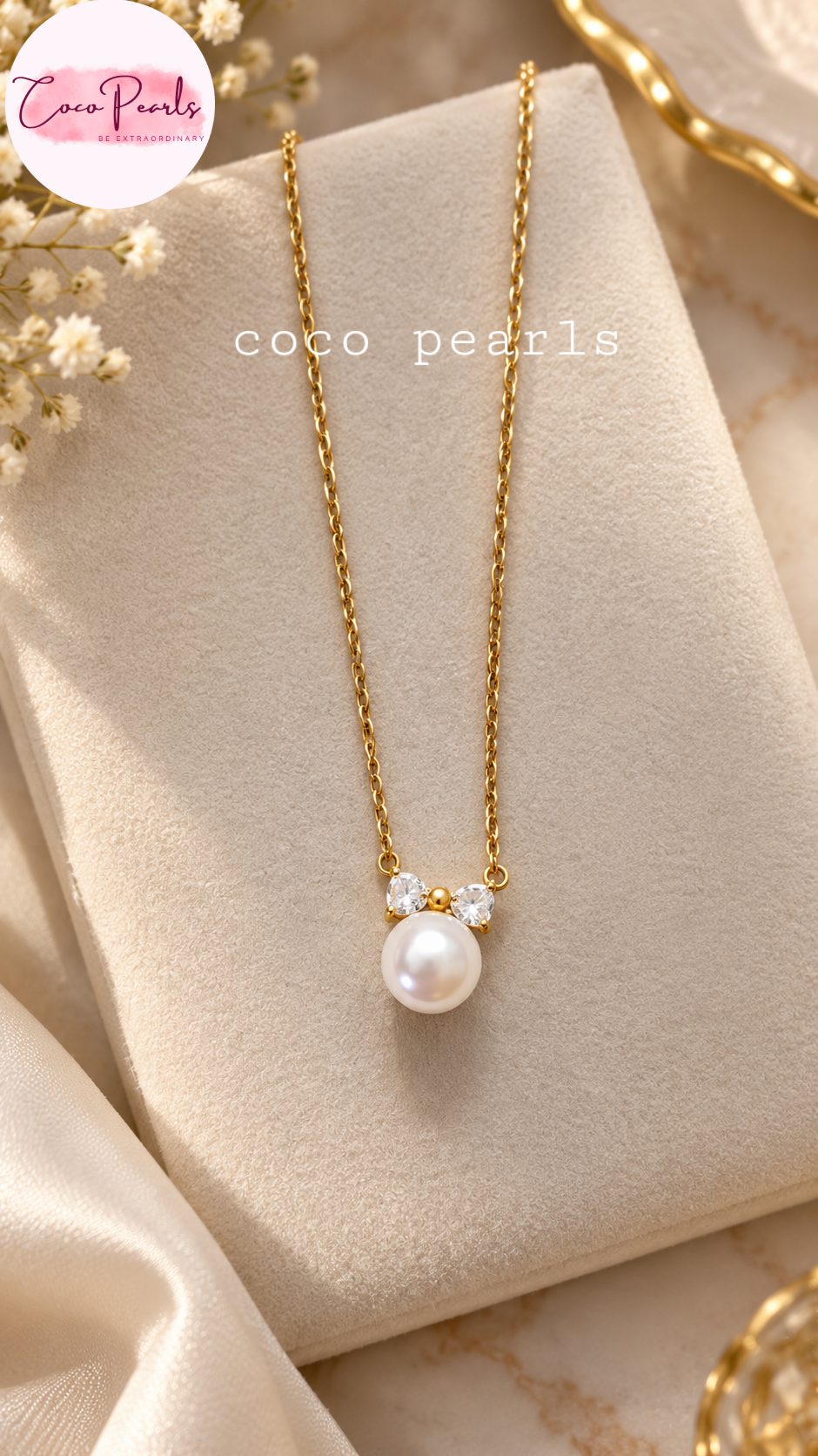 Coco pearls stainless Steel anti tarnish gold chain necklace with a white pearl pendant and small clear stones, displayed on a cream jewelry stand.