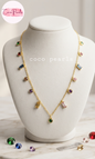 Coco pearls stainless Steel anti tarnish gold chain necklace with multiple colorful gemstone charms displayed on a white jewelry bust. 