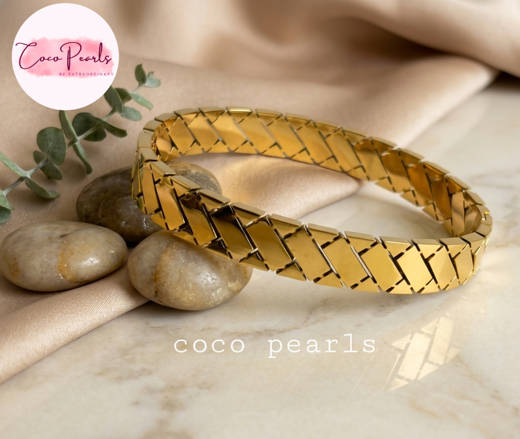 Coco pearls stainless Steel anti tarnish gold  grid handcuff displayed on simple background 