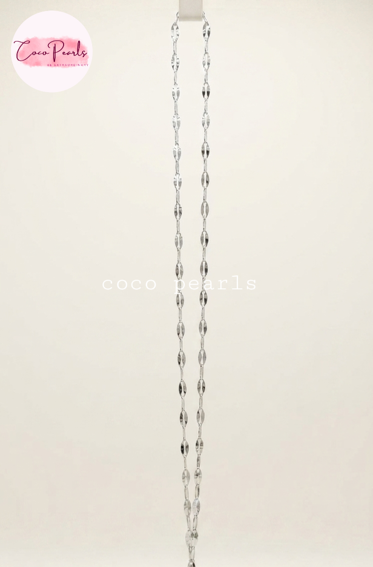 Coco Pearls stainless Steel anti tarnish silver rice chain displayed on simple background 