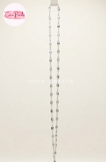 Coco Pearls stainless Steel anti tarnish silver rice chain displayed on simple background 