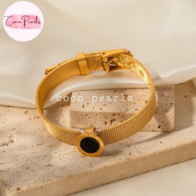 Coco pearls stainless Steel anti tarnish gold roman chain bracelet displayed on simple background 