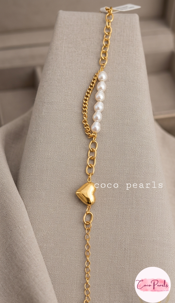 Coco pearls stainless Steel anti tarnish gold  bracelet displayed on simple background 