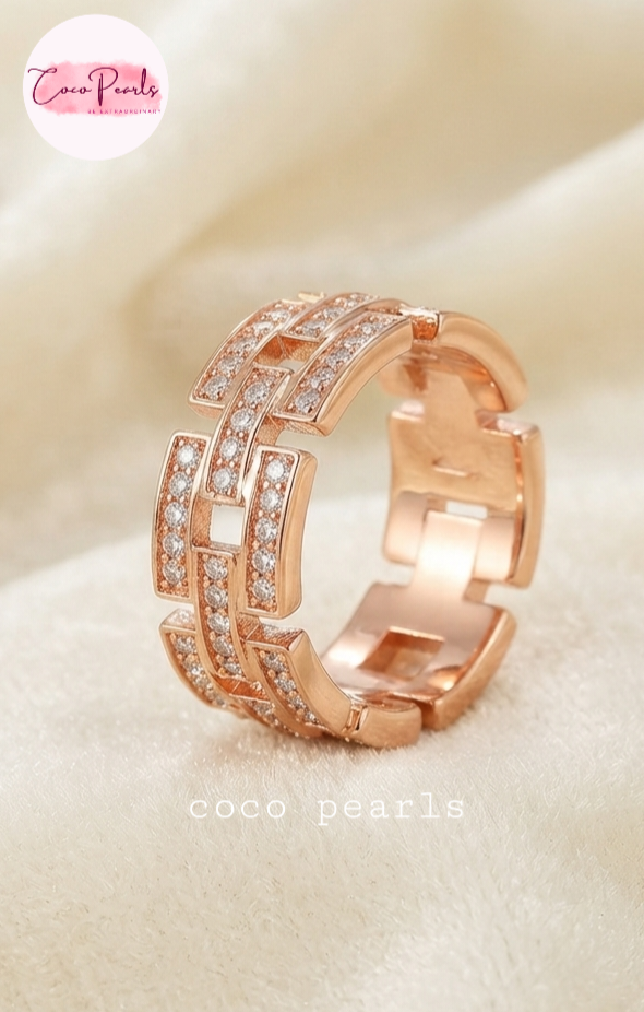 Coco pearls stainless Steel anti tarnish rose gold diamond studded ring displayed on simple background 