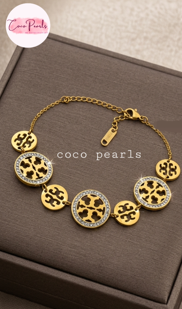 Coco pearls stainless Steel anti tarnish Waterproof Gold bracelet with stone studded design on a brown box