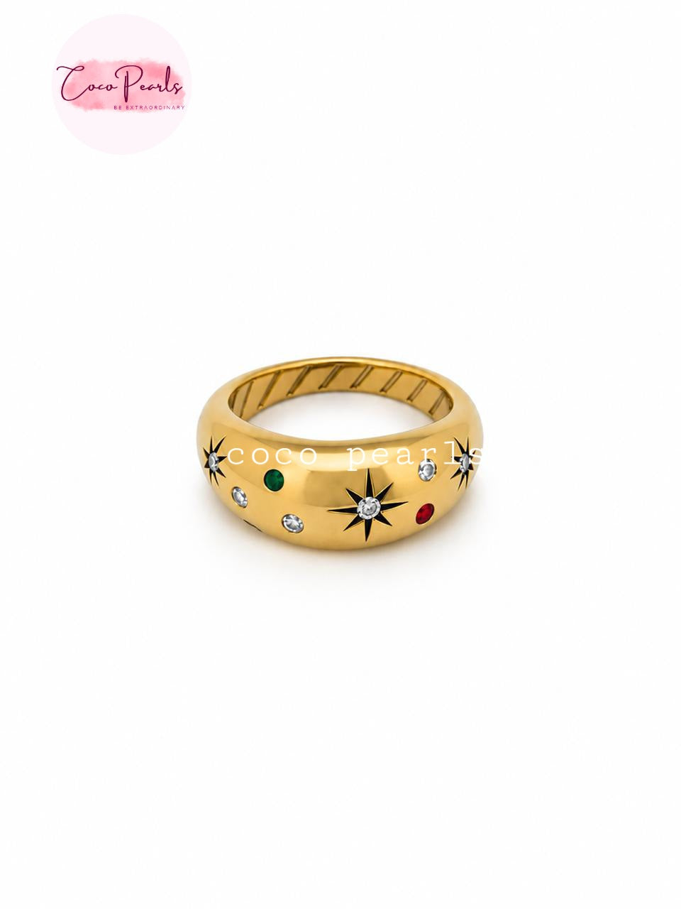 Coco pearls stainless Steel anti tarnish gold band ring featuring a textured outer channel, a smooth inner band, and decorative starburst motifs accented with small colored stones in green, red, and clear crystals.