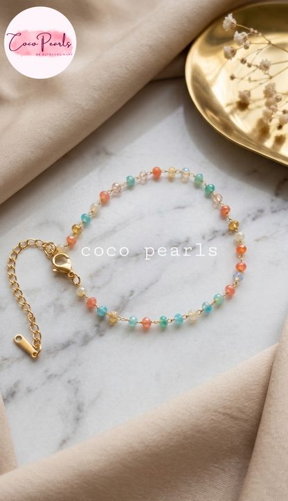 Coco pearls stainless Steel anti tarnish gold  colorful beaded bracelet displayed on simple background 