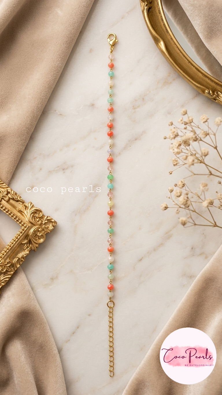 Coco pearls stainless Steel anti tarnish gold  sunset mist colourful beaded bracelet displayed on simple background 
