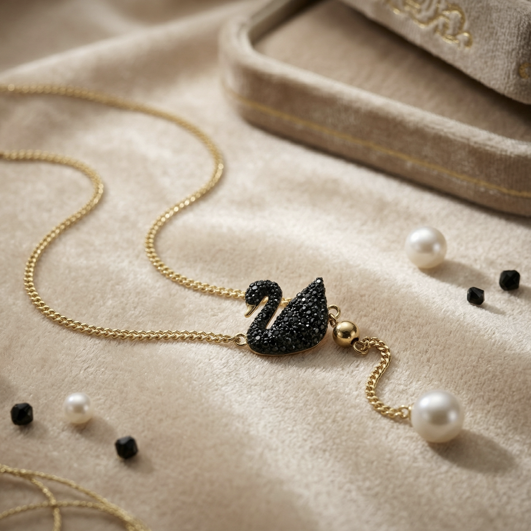 Coco pearls stainless Steel anti tarnish black swan with pearl hanging displayed on simple background 