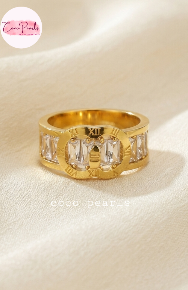 Coco pearls stainless Steel anti tarnish gold timeless coco diamond studded ring displayed on simple background 