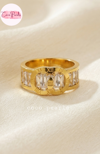 Coco pearls stainless Steel anti tarnish gold timeless coco diamond studded ring displayed on simple background 
