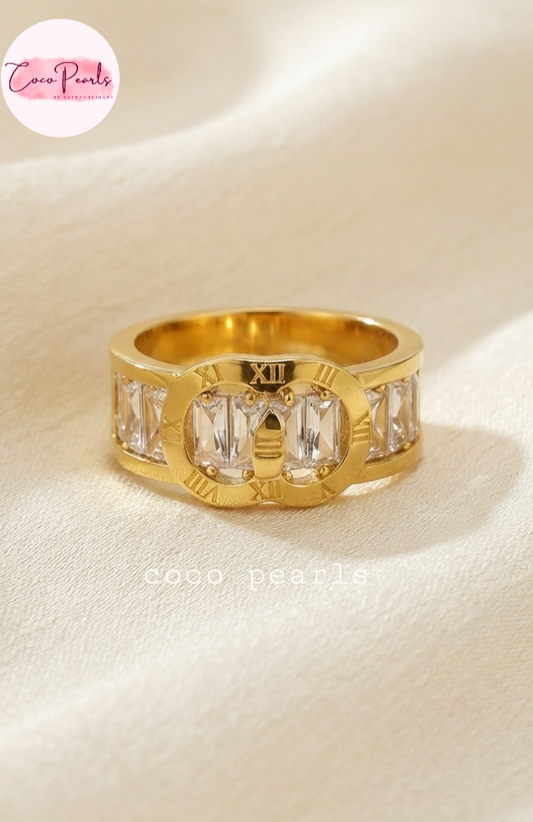 Coco pearls stainless Steel anti tarnish gold timeless coco diamond studded ring displayed on simple background 