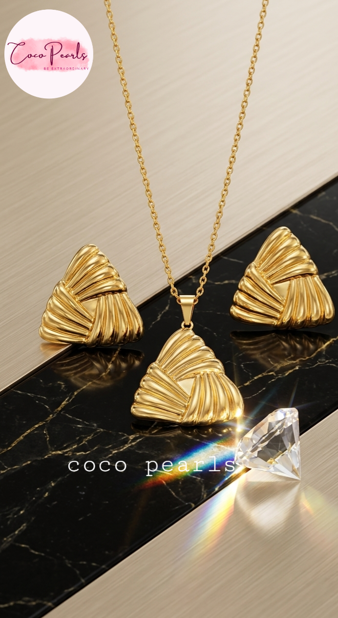 Stainless Steel Anti Tarnish Gold necklace and earrings set on a marble surface with 'Coco Pearls' branding.
