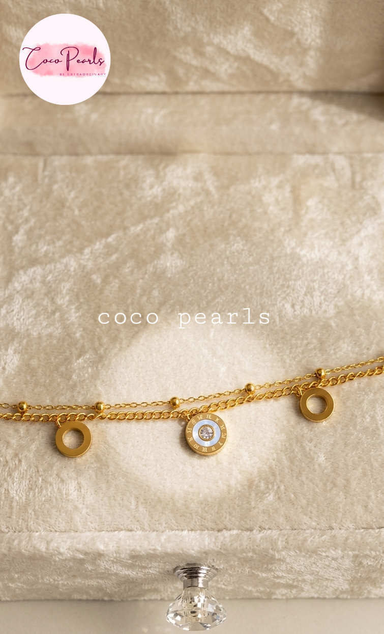 Coco pearls stainless Steel anti tarnish gold  triple Circle Charm Bracelet with triple coin circles displayed on simple background 