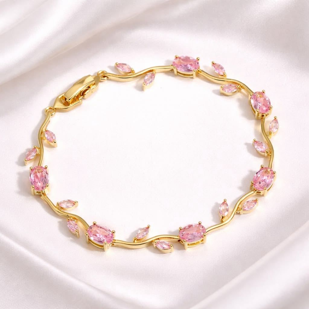 Coco pearls Gold bracelet with pink gemstones on a white background