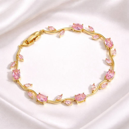 Coco pearls Gold bracelet with pink gemstones on a white background