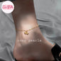 Coco pearls stainless Steel anti tarnish delicate gold chain anklet with two small bead-like bell charms is shown worn on a person's ankle.