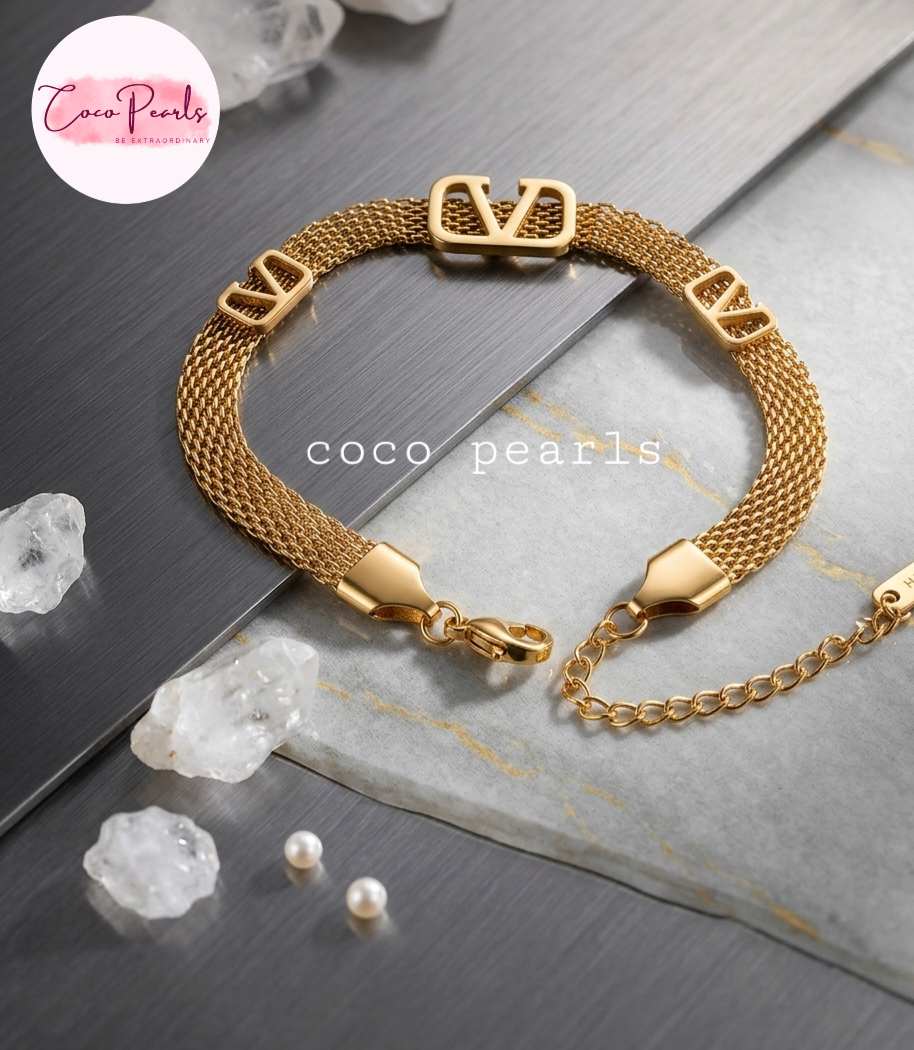 Coco pearls stainless Steel anti tarnish gold v mesh bracelet displayed on grey background 
