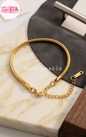 Coco pearls stainless Steel anti tarnish gold wheat braid bracelet displayed on simple background 