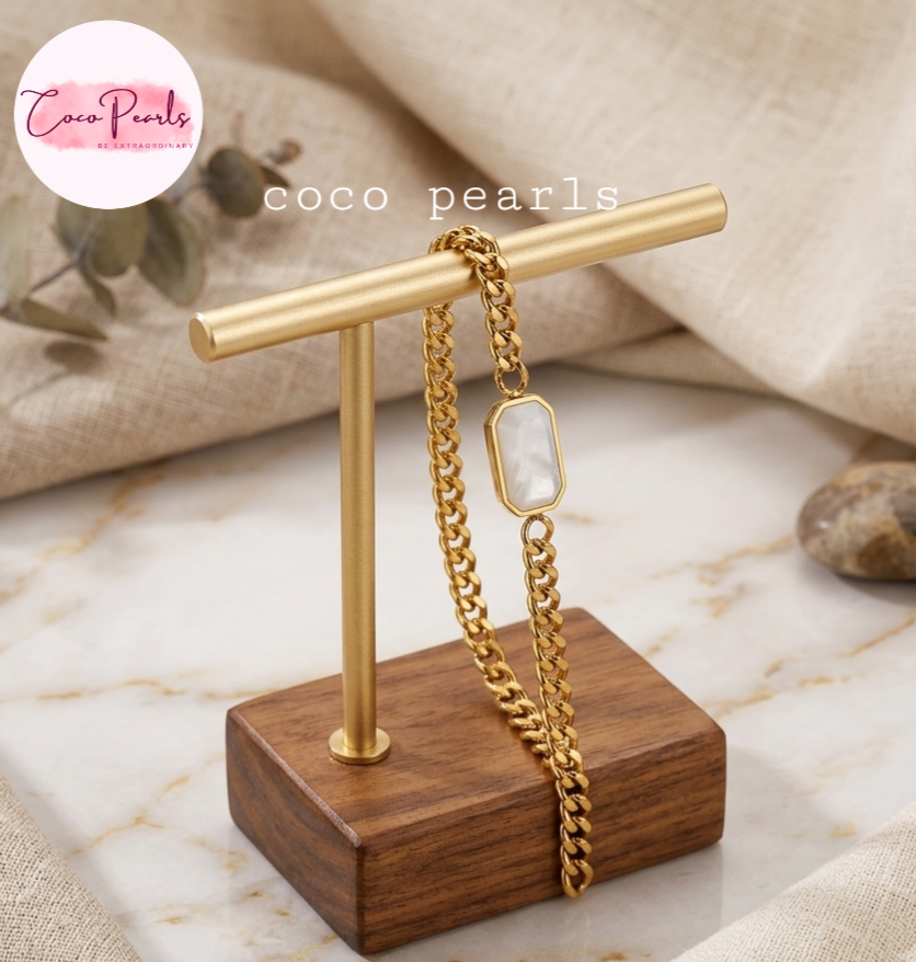 Coco pearls stainless Steel anti tarnish gold  white whisper bracelet displayed on wooden stand