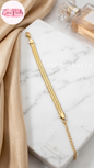 Coco pearls stainless Steel anti tarnish gold wide snake cahin bracelet displayed on simple background 