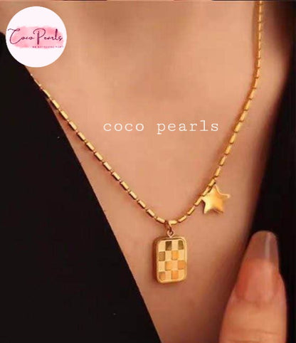 Coco Pearls Stainless Steel Anti Tarnish Gold necklace with star and checkered pendant on a person's neck