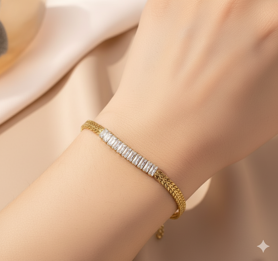 Coco Pearls Stainless steel Anti Tarnish Gold aurum spark bracelet with a subtle pattern on a wrist against a soft beige background