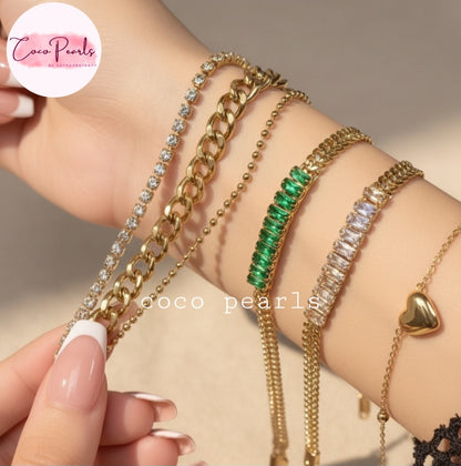 Coco Pearls Stainless steel Anti Tarnish Gold bracelets with different bracelets stacked on a wrist