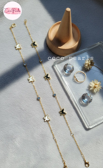 Coco Pearls Stainless Steel Anti Tarnish golden butterfly link bracelet with white and black butterflies and clear stones
