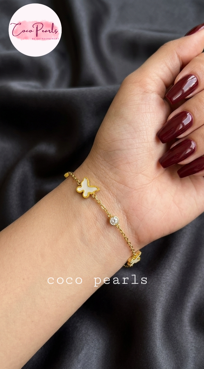 Coco Pearls Stainless Steel Anti Tarnish golden butterfly link bracelet with black butterflies and clear stones