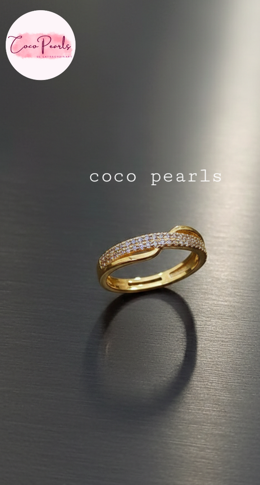 coco pearls stainless steel anti tarnish gold celeste hex adjustable diamond studded ring displayed on metallic surface