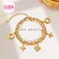 Coco Pearls Stainless steel anti tarnish Gold double layer bracelet with charms on a white background