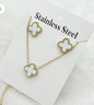 coco pearls stainless steel anti tarnish gold and white clover set earrings and Necklace with clover-shaped on a white card