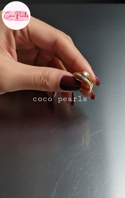 coco pearls stainless steel anti tarnish gold crown solitaire adjustable diamond studded ring displayed on metallic surface