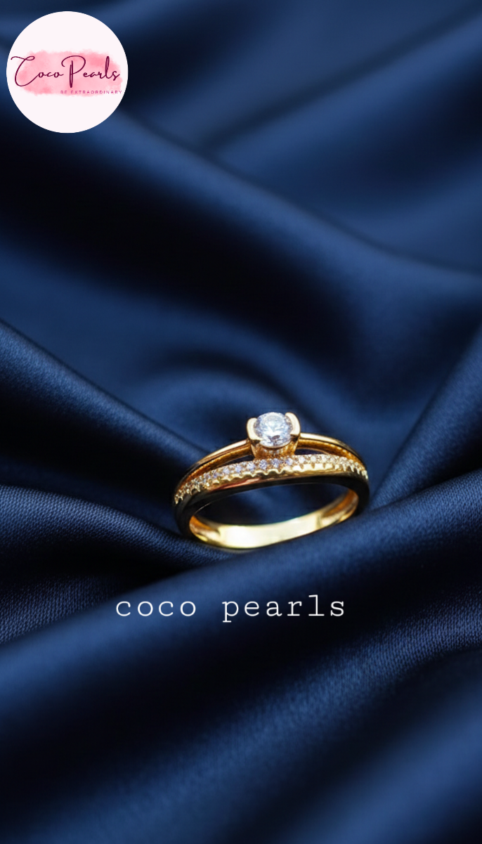 coco pearls stainless steel anti tarnish gold crown solitaire adjustable diamond studded ring displayed on blue satin
