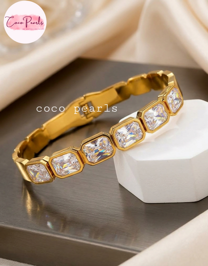 Anti tarnish stainless Steel Waterproof Gold bracelet with clear crystals on a neutral background, featuring the brand 'Coco Pearls'.
