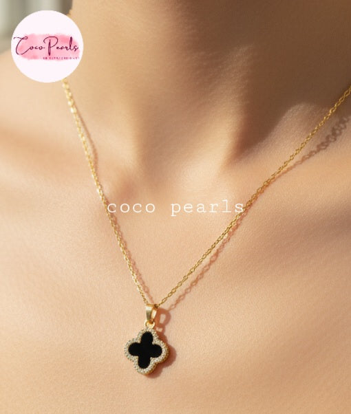 Coco Pearls Stainless Steel Anti Tarnish Two sided diamond studded gold necklaces with clover-shaped pendants one side black one side white on neck