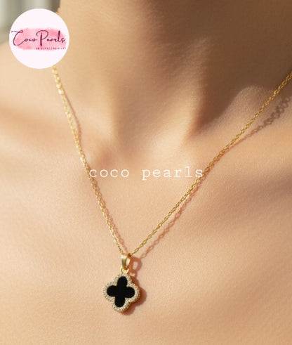 Coco Pearls Stainless Steel Anti Tarnish Two sided diamond studded gold necklaces with clover-shaped pendants one side black one side white on neck