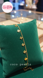 Gold bCoco Pearls Stainless Steel Anti Tarnish Gold delight anklet with clover-shaped charms on a green pillow