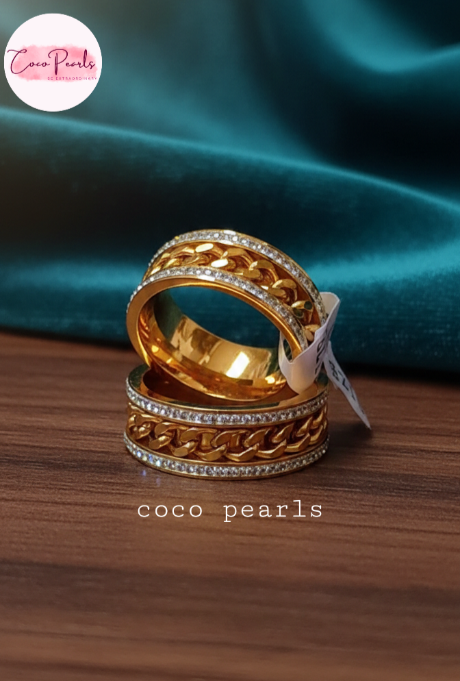 coco pearls stainless steel anti tarnish gold diamond studded with metal chain in center 2 rings displayed