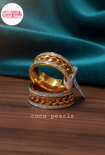 coco pearls stainless steel anti tarnish gold diamond studded with metal chain in center 2 rings displayed