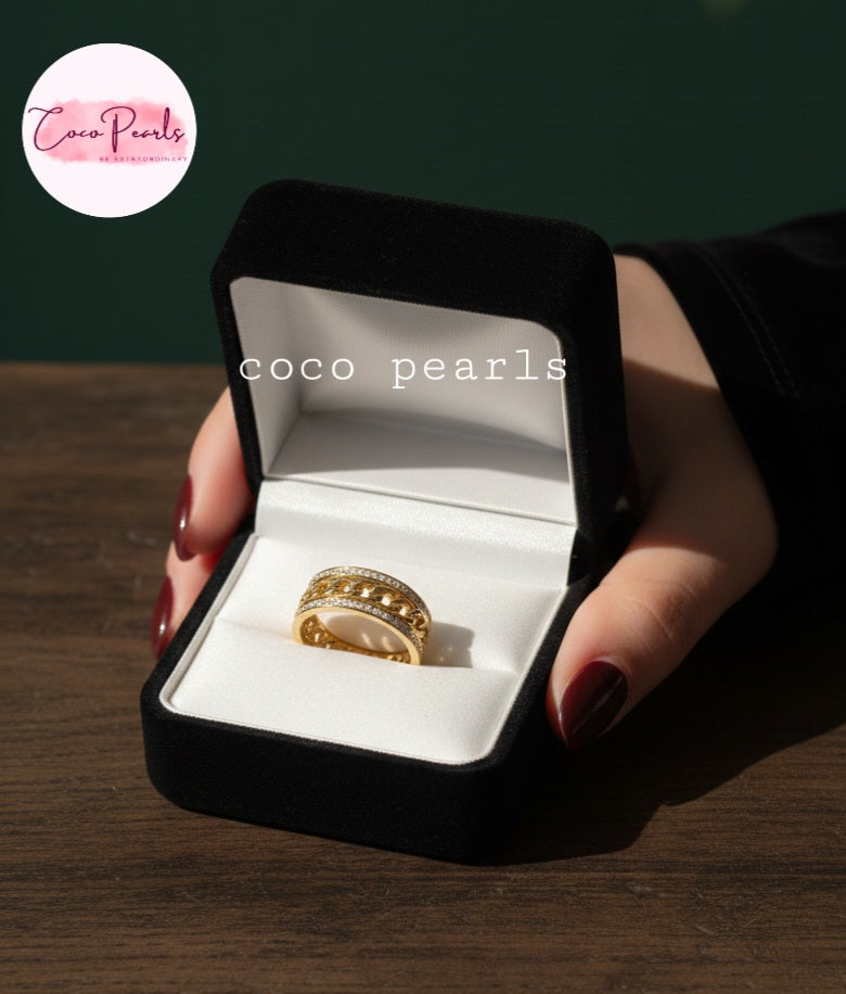 coco pearls stainless steel anti tarnish gold diamond studded with metal chain in center displayed in a jewelry box