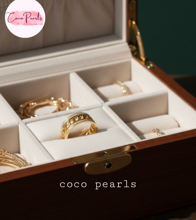 coco pearls stainless steel anti tarnish gold diamond studded with metal chain in center displayed in a jewelry box
