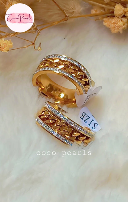 coco pearls stainless steel anti tarnish gold diamond studded with metal chain in center displayed on white fabric