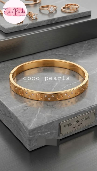 Coco Pearls Stainless Steel Anti tarnish gold diamond groove handcuff with floral design and diamonds