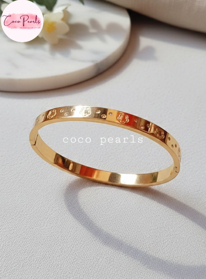 Coco Pearls Stainless Steel Anti tarnish gold diamond groove handcuff with floral design and diamonds