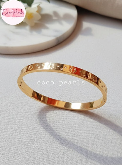 Coco Pearls Stainless Steel Anti tarnish gold diamond groove handcuff with floral design and diamonds