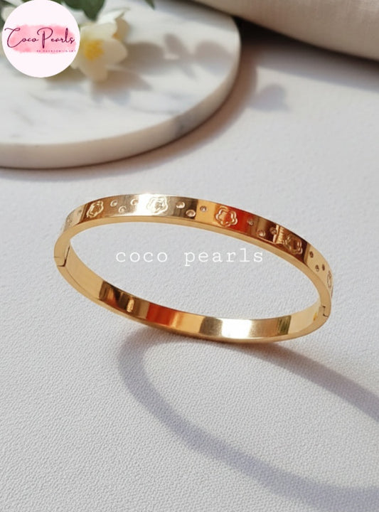 Coco Pearls Stainless Steel Anti tarnish gold diamond groove handcuff with floral design and diamonds