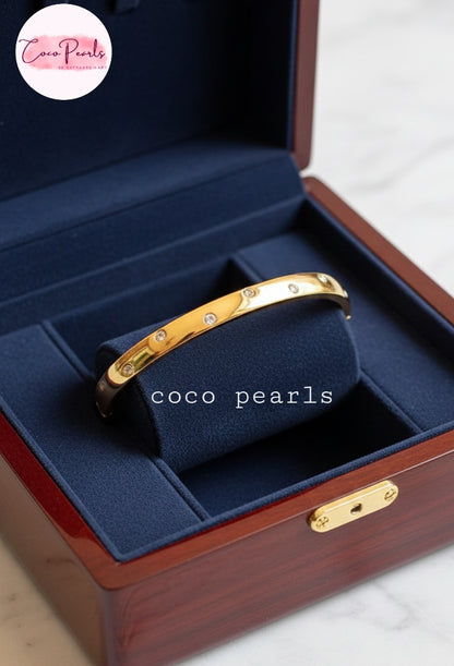Coco Pearls Stainless Steel Anti tarnish Gold diamond halo handcuff bracelet diamond studded in a blue jewelry box